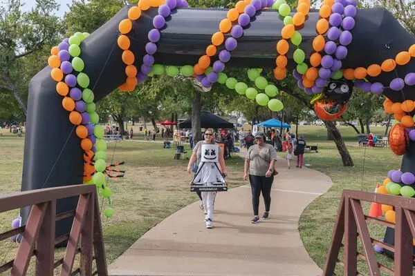 Large Halloween decorated trail with costumed people.
