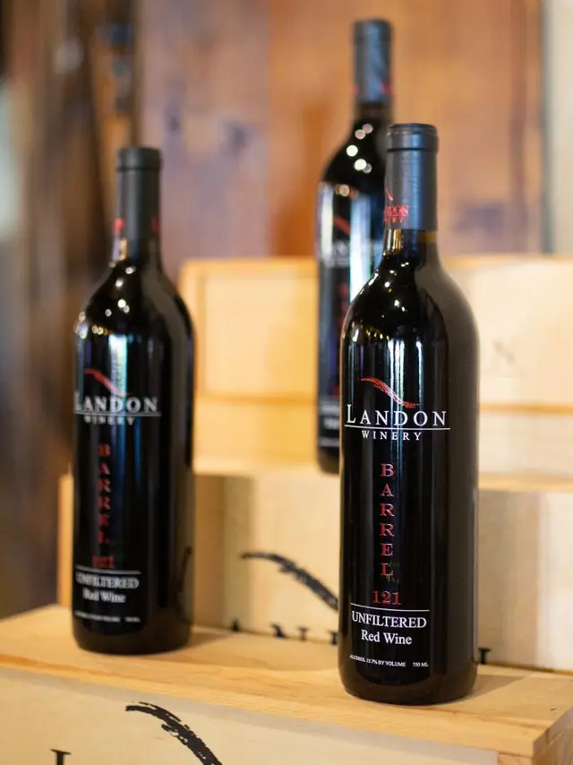 Landon wine - three bottles of wine standing on a table