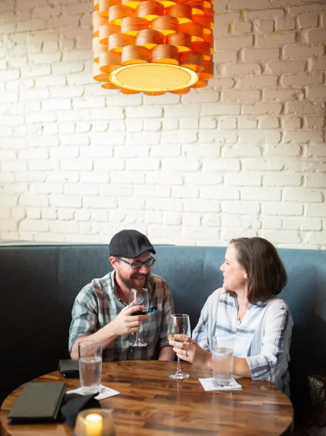 Urban Grill - couple at a table with wine glasses
