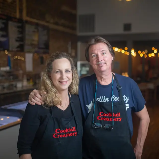 man and woman wearing Cocktail Creamery aprons